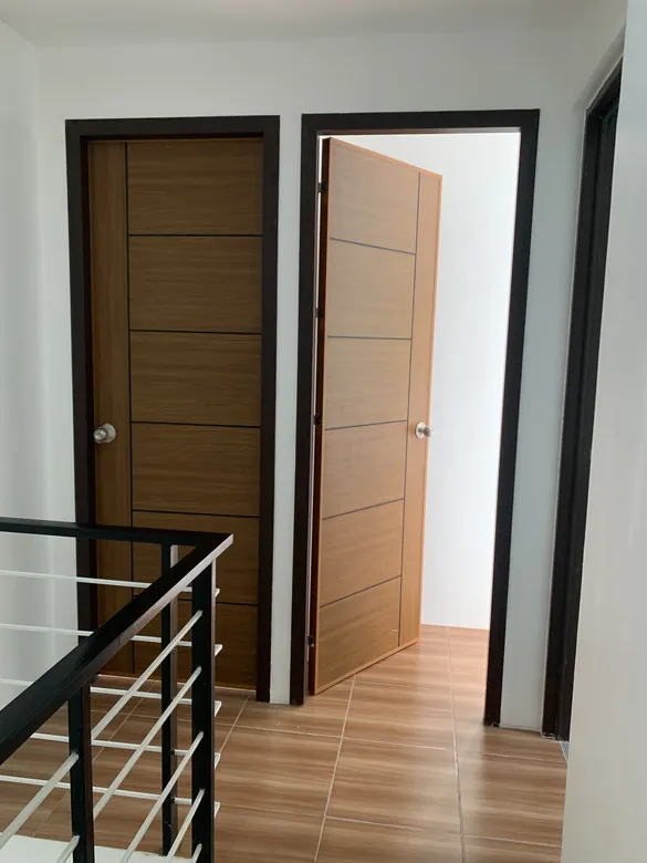 Black-framed Polydoors on a stair landing