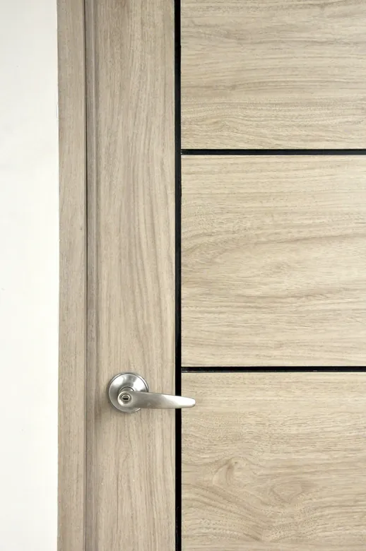 Grooved Polydoor with a brushed lever handle, close up